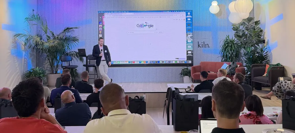 Jon Cheney presenting a live AI workshop to a full room of attendees