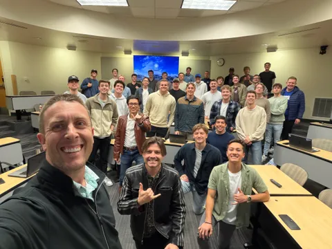 The GenAIPI team and students gathered after an AI hackathon session